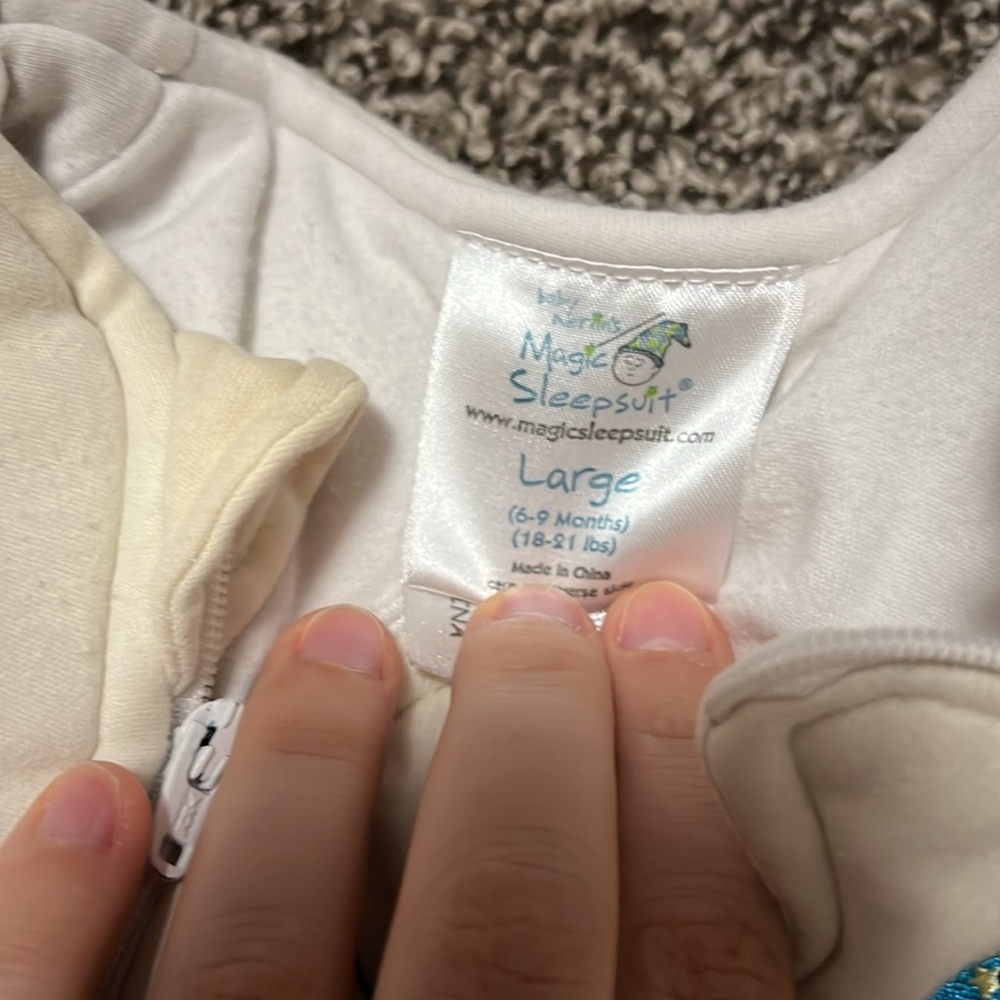 1 Merlin’s magic sleep suit, size large.
